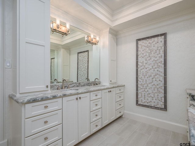 bathroom featuring crown molding, vanity, a raised ceiling, and tile patterned flooring