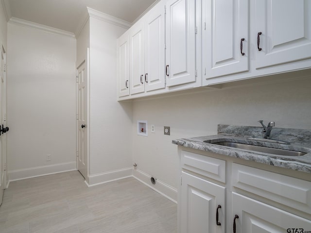 laundry area featuring sink, crown molding, hookup for a washing machine, cabinets, and hookup for an electric dryer