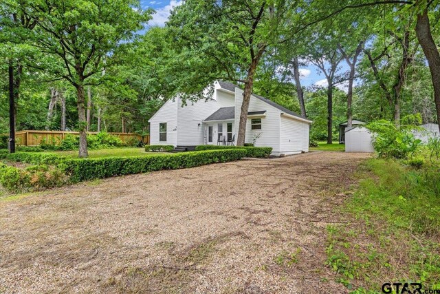 194 Debra Dr, Bullard, TX 75757 - view of property exterior featuring an outdoor structure, a shed, and dirt driveway