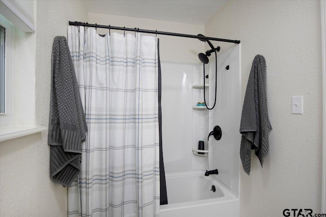 194 Debra Dr, Bullard, TX 75757 - bathroom with a textured wall and shower / bath combo with shower curtain