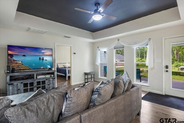 194 Debra Dr, Bullard, TX 75757 - living area with a tray ceiling, ceiling fan, baseboards, and wood finished floors