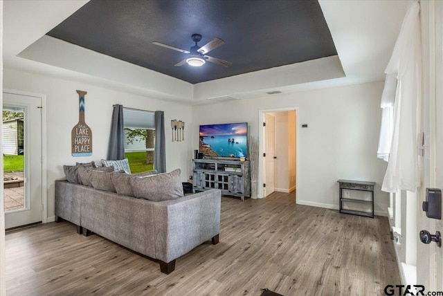 194 Debra Dr, Bullard, TX 75757 - living area featuring a tray ceiling, wood finished floors, and a ceiling fan