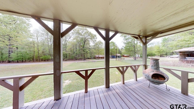 wooden deck with a yard