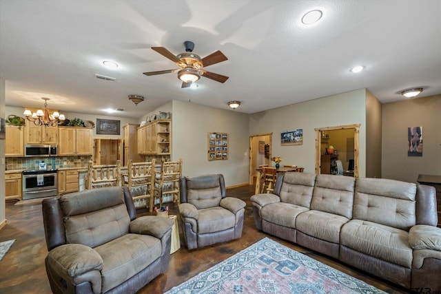 living room featuring ceiling fan with notable chandelier