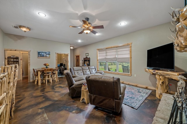 living room with a textured ceiling and ceiling fan