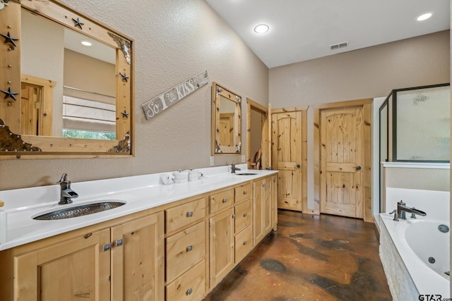 bathroom featuring vanity and independent shower and bath