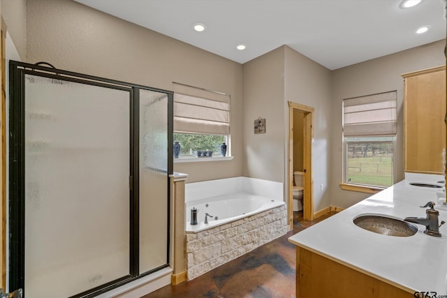 full bathroom featuring vanity, toilet, and independent shower and bath