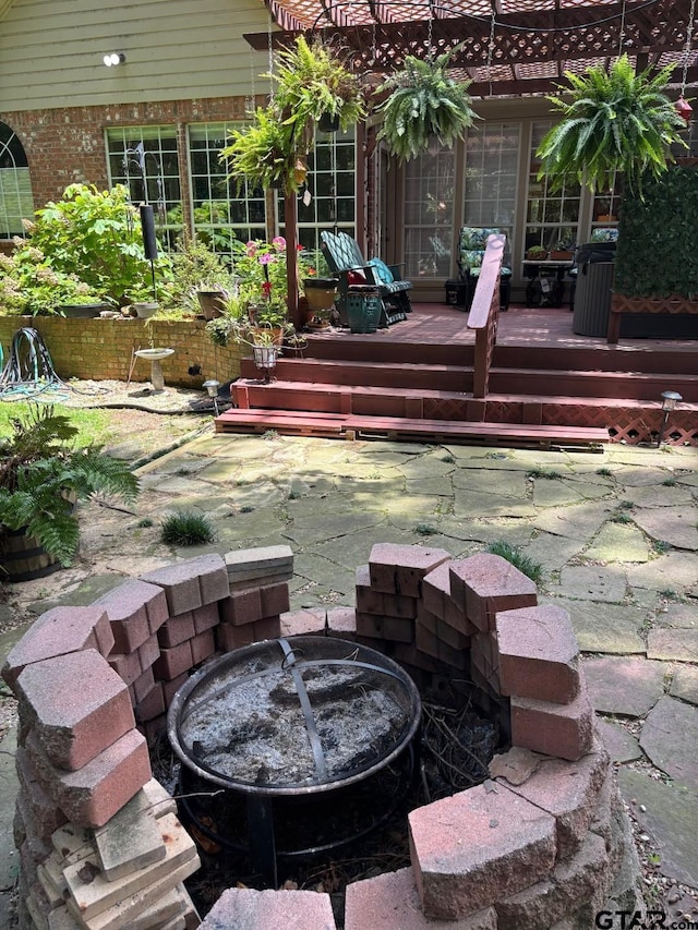 18378 Whipporwill Ln, Flint, TX 75762 - view of patio with a wooden deck and an outdoor fire pit
