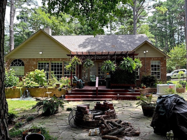 18378 Whipporwill Ln, Flint, TX 75762 - back of property featuring a patio area, brick siding, a deck, and roof with shingles