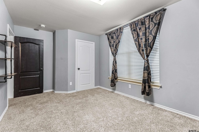 unfurnished bedroom with carpet floors