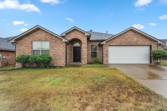 ranch-style house featuring a garage and a front yard