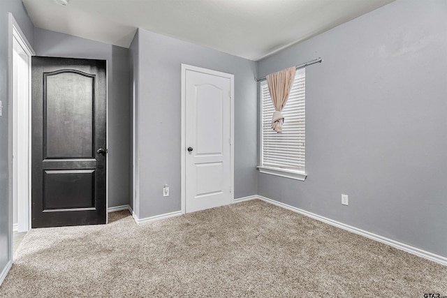 unfurnished bedroom featuring carpet flooring