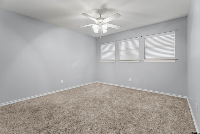 carpeted empty room with ceiling fan