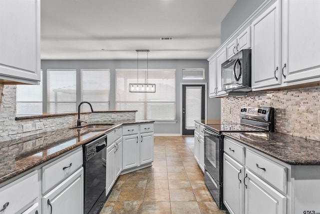 kitchen with white cabinets, black appliances, sink, and pendant lighting