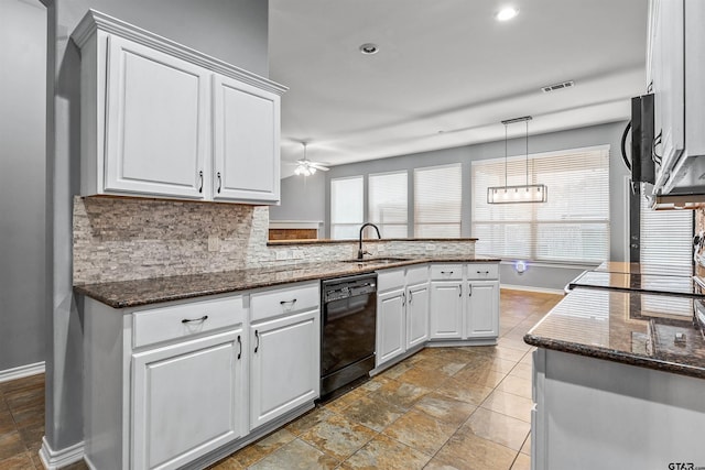 kitchen featuring decorative light fixtures, black dishwasher, sink, white cabinets, and kitchen peninsula