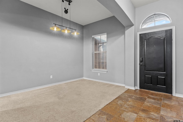 view of carpeted entrance foyer