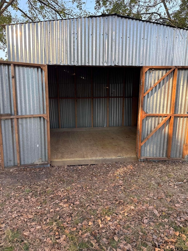 view of gate featuring an outdoor structure