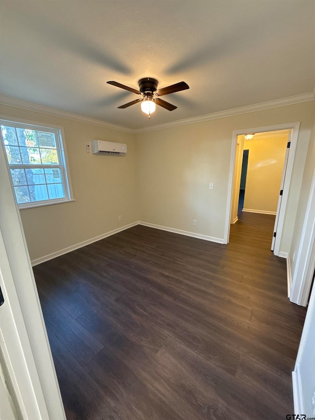 spare room with a wall unit AC, ceiling fan, dark hardwood / wood-style flooring, and ornamental molding