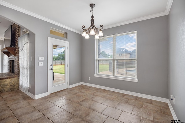 213 Coventry St, Bullard, TX 75757 - unfurnished dining area with a chandelier, crown molding, a fireplace, stone finish flooring, and arched walkways