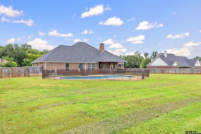 213 Coventry St, Bullard, TX 75757 - back of property featuring a fenced backyard, a chimney, and brick siding