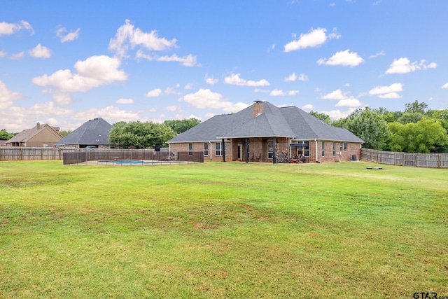 213 Coventry St, Bullard, TX 75757 - back of house featuring a fenced backyard, brick siding, and a chimney