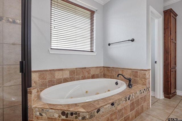 213 Coventry St, Bullard, TX 75757 - bathroom with a tub with jets, tile patterned floors, and ornamental molding