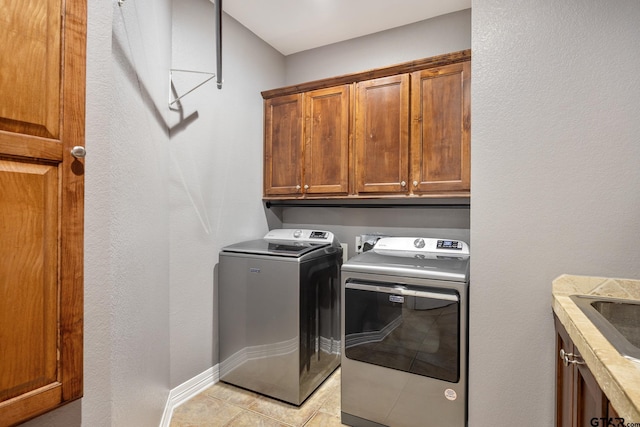 213 Coventry St, Bullard, TX 75757 - laundry room featuring cabinet space, washer and dryer, and light tile patterned flooring