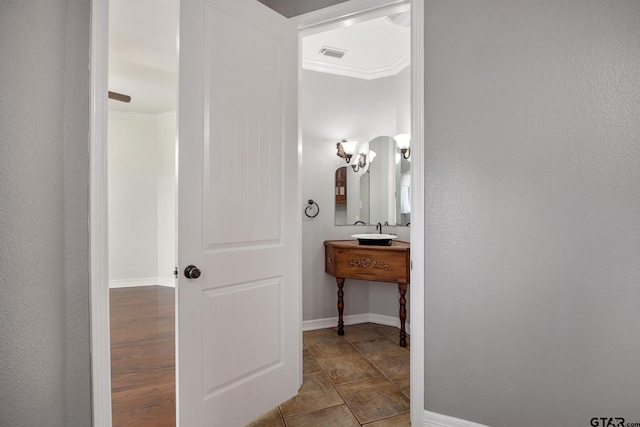 213 Coventry St, Bullard, TX 75757 - bathroom featuring baseboards and crown molding
