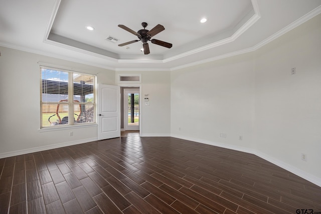 213 Coventry St, Bullard, TX 75757 - spare room with a tray ceiling, ceiling fan, dark wood-type flooring, ornamental molding, and recessed lighting