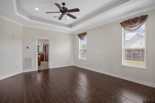 213 Coventry St, Bullard, TX 75757 - empty room featuring a tray ceiling, a ceiling fan, dark wood-style floors, crown molding, and recessed lighting