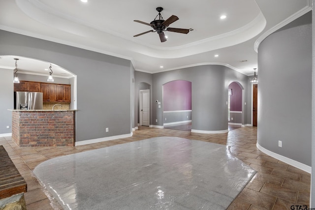 213 Coventry St, Bullard, TX 75757 - living room featuring a raised ceiling, arched walkways, a ceiling fan, recessed lighting, and ornamental molding