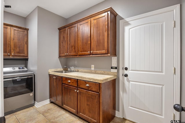 213 Coventry St, Bullard, TX 75757 - laundry room featuring washer / dryer, cabinet space, and light tile patterned flooring
