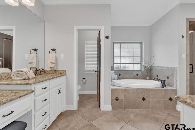 13452 Karah Ln, Lindale, TX 75771 - bathroom with vanity, toilet, a garden tub, tile patterned floors, and a shower stall