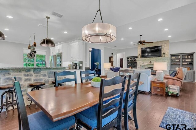 13452 Karah Ln, Lindale, TX 75771 - dining room with a ceiling fan, wood finished floors, recessed lighting, and a fireplace