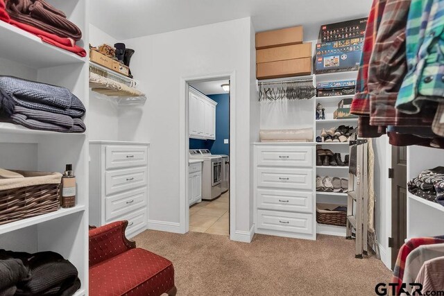 13452 Karah Ln, Lindale, TX 75771 - spacious closet featuring light carpet, independent washer and dryer, and light tile patterned flooring