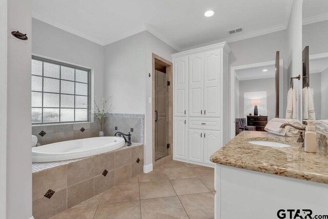 13452 Karah Ln, Lindale, TX 75771 - full bathroom featuring a bath, vanity, crown molding, a shower stall, and tile patterned flooring