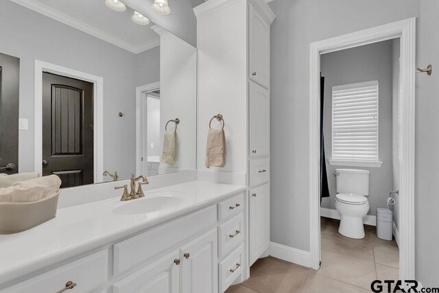 13452 Karah Ln, Lindale, TX 75771 - full bathroom with crown molding, vanity, tile patterned floors, toilet, and baseboards