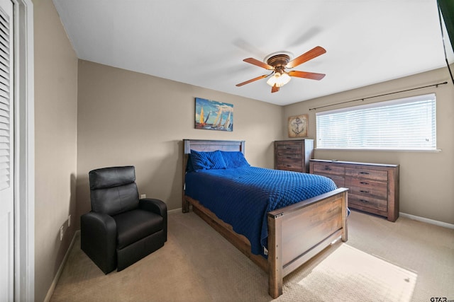 carpeted bedroom featuring ceiling fan