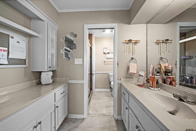 bathroom featuring ornamental molding, an enclosed shower, vanity, and toilet