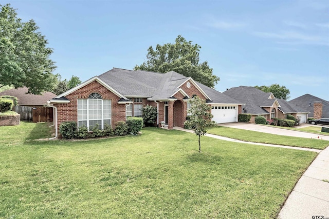 view of front of home with a front yard and a garage