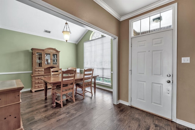 dining room featuring lofted ceiling, dark hardwood / wood-style flooring, and ornamental molding