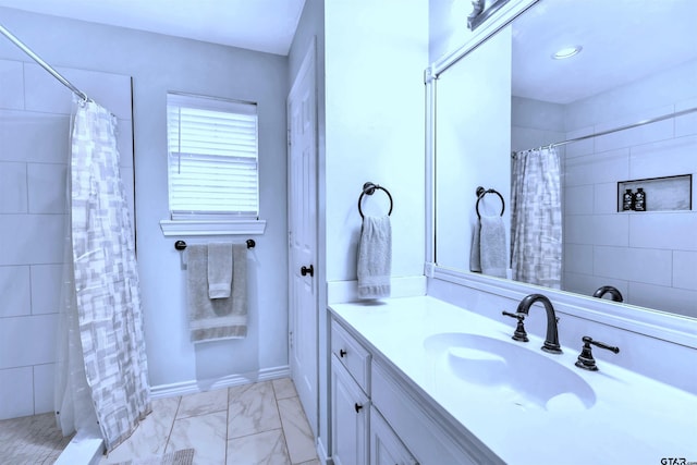 bathroom with vanity and walk in shower