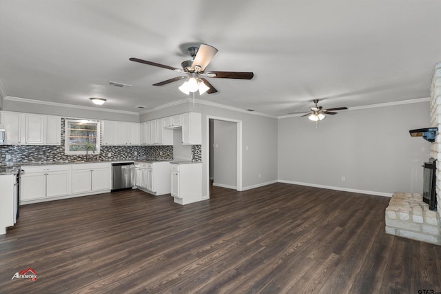 kitchen featuring sink, white cabinetry, tasteful backsplash, stainless steel dishwasher, and ornamental molding