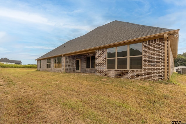 rear view of house with a lawn