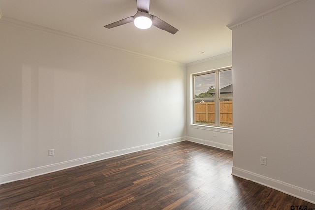 spare room with crown molding, dark wood-type flooring, and ceiling fan