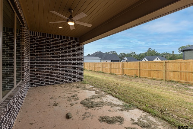 view of yard with a patio and ceiling fan