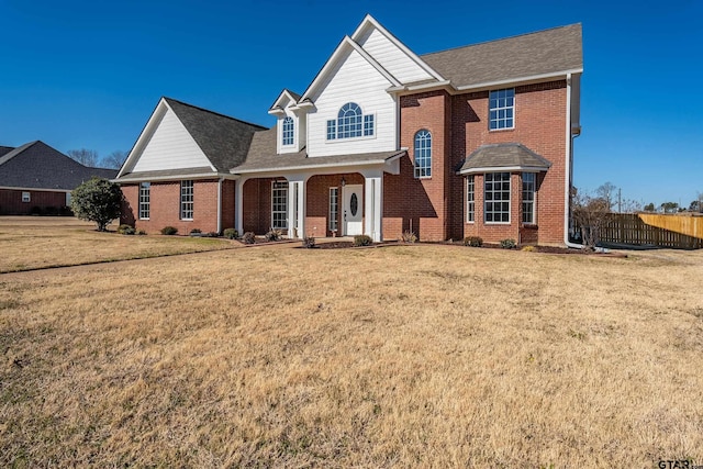 front of property with a porch and a front yard