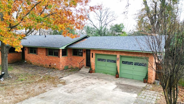 ranch-style house featuring a garage