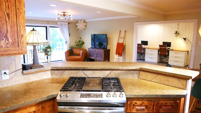 kitchen with stainless steel range oven and crown molding