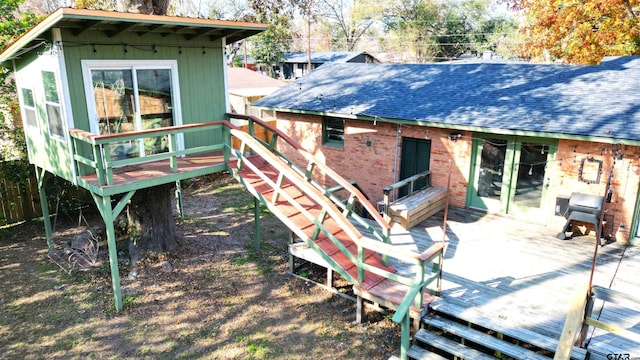 rear view of property with a deck